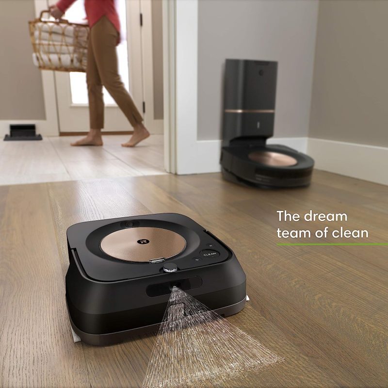 Roomba s9+ robot vacuum automatically emptying its bin into the Clean Base for convenient disposal