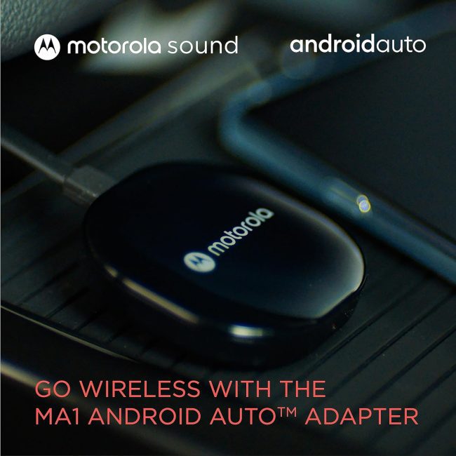 Wireless Android Auto car adapter plugged into USB connection in a vehicle