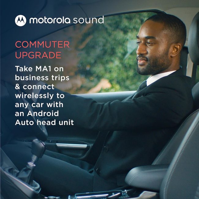 Businessman driving with Motorola MA1 Wireless Android Auto Car Adapter for streamlined connectivity