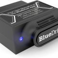BlueDriver scan tool connected to a car's OBD port for real-time vehicle diagnostics