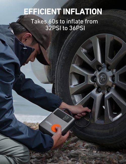 Person inflating car tire using a portable air compressor showing tire pressure at 32.0 PSI