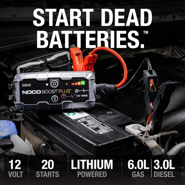 NOCO Boost Plus GB40 connected to a car battery, suitable for jump-starting up to 6.0L Gas and 3.0L Diesel engines