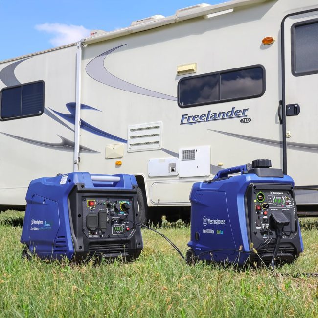 Two Westinghouse portable generators providing power to a Freelander recreational vehicle on a sunny day