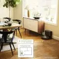 Roomba j7+ robot vacuum automatically disposing dirt into the Clean Base