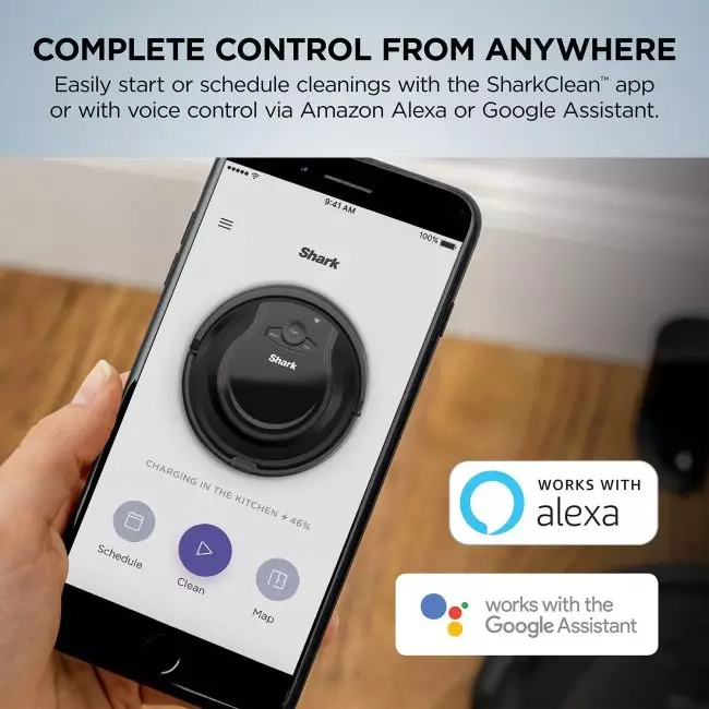 Shark ION Robot Vacuum's multi-surface brushroll picking up debris from carpets and floors