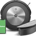 iRobot Roomba Combo j5 robot vacuum and mop seamlessly transitioning from carpet to hardwood floor