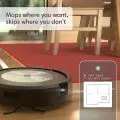 Close-up of the Roomba Combo j5's 4-Stage Cleaning System capturing pet hair and debris