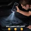 Person using a 300-lumen LED portable light on a car engine, featuring flashlight, SOS, and strobe modes