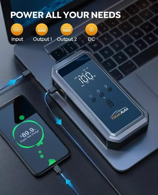 YaberAuto portable power station charging a laptop and a smartphone showing super fast charge