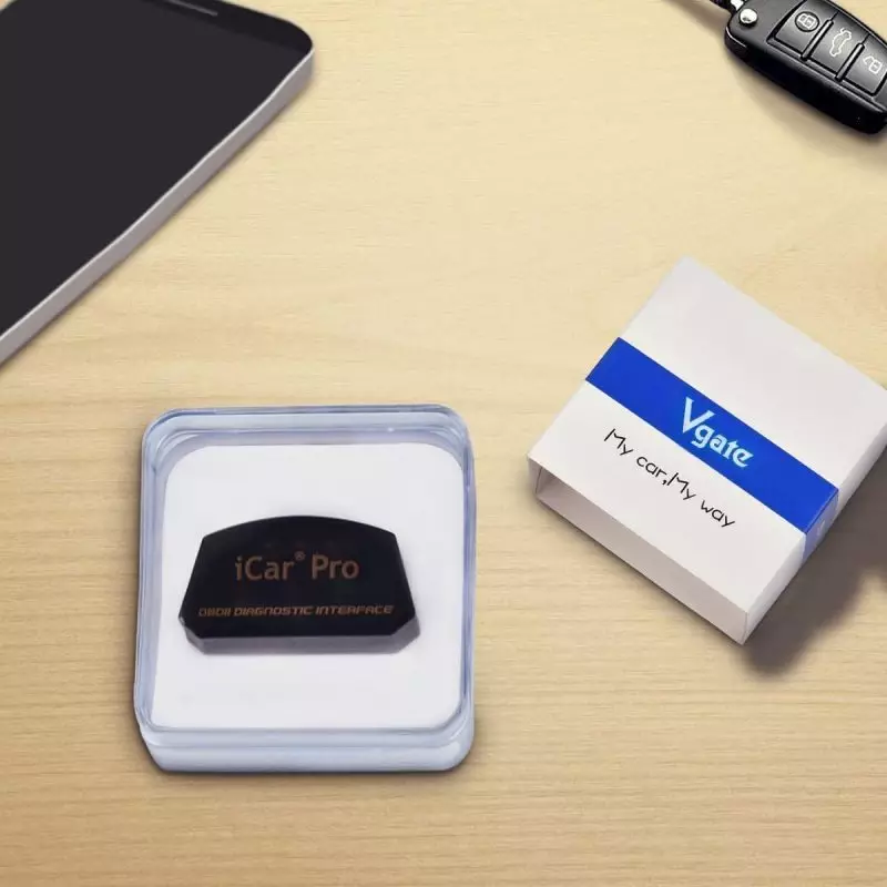 Vgate iCar Pro OBD2 Scanner for Easy Vehicle Diagnostics Vgate iCar Pro OBDII Diagnostic Device in Packaging on Desktop with Smartphone and Car Key