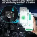 OBD2 diagnostic tool connected in a car, displaying data on a smartphone app
