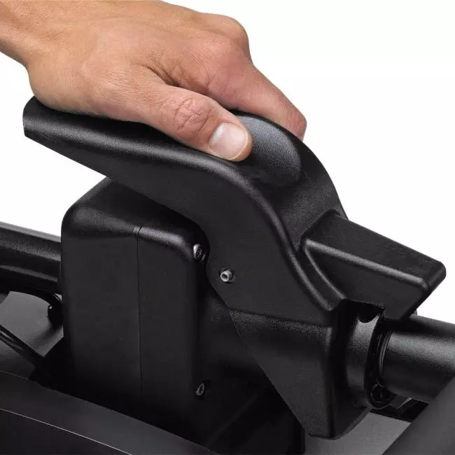 Close-up view of a human hand gripping the black handle of a Minn Kota Riptide PowerDrive 70 trolling motor