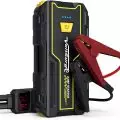 Portable 2000A car jump starter with heavy-duty cables and a digital charge level indicator