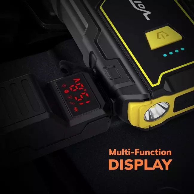 Portable 2000A car jump starter displaying various vehicle warning indicators and battery level