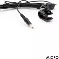 Close-up of a clip-on lavalier microphone with a cable and 3.5mm audio jack