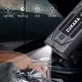 Person using a ZUKAKA portable LED light under the hood of a car,   showing its functionality in automotive repair with Lighting,   Warning,   SOS,   and Strobe modes.