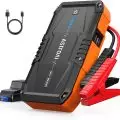 AstroAI portable car jump starter 12V 1500A model with red and black clamps and a USB charging cable