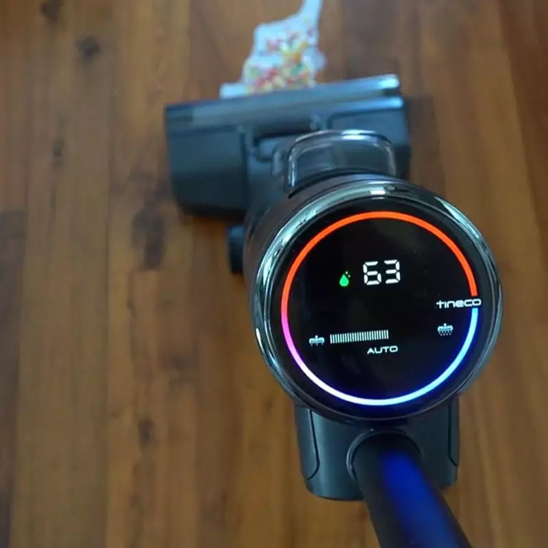 Efficient Cleaning with Tineco Vacuum on Hardwood Floors Tineco vacuum cleaner in auto mode on hardwood floor with debris
