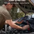 Person using a lithium-powered jump starter on a car battery, suitable for gas up to 6L and diesel up to 3L engines
