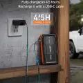 ASTROAI battery pack being charged from a wall charger in an outdoor setting,   4.5 hours fast charge feature highlighted