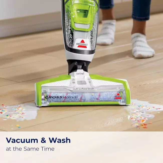 Bissell CrossWave vacuum cleaner cleaning hardwood floor with liquid and cereal spill