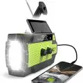 Portable emergency radio with hand crank,   solar panel,   flashlight,   and mobile charging capability