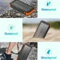 Durable solar power bank showing its waterproof,   dustproof,   and shockproof features in various environments like underwater,   sand,   and rocky terrain